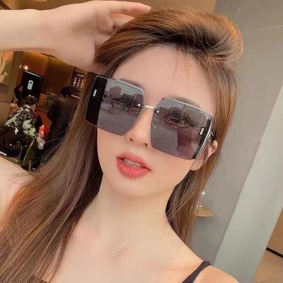 China Square or box 2022 new DIN women's fashion frameless cut edge sunglasses street shot sharp red polarized sunglasses for sale