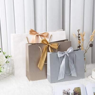 China RJN012 Handmade Luxury Personalized Large White Paper Kraft Paper Bags Packaging Bag With Printing Wholesale for sale