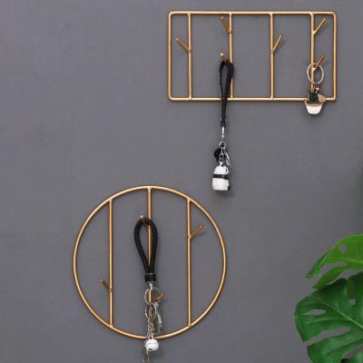 China Simple and Modern Nordic Style Simple Shelf Living Room Gold Metal Art Hanging Wall Mounted Storage Living Room Pendant Main Hook Small for sale