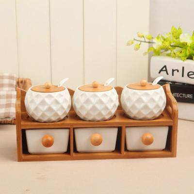 China Viable Simple Fashion Kitchenware New Arrival Bottle Jar Set Ceramic Spice Seasoning Container With Bamboo Wood Shelf for sale