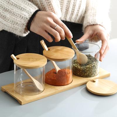 China Viable Wholesale Fashion Nordic Simple Style Kitchen Tableware Bottle Jar Set Glass Seasoning Container With Bamboo Cover for sale