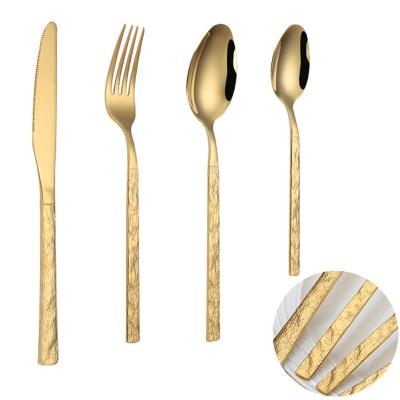 China Viable Luxury Baroque Wedding 18/10 Stainless Steel Flatware Set With Hammer Point Handle Wedding Gold Flatware for sale