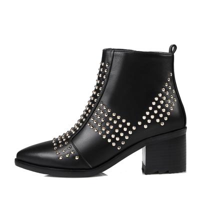 China Fashionable Ladies Rubber Black Leather Studded Ankle Boots Pointed Toe Rivet Winter Boots for sale