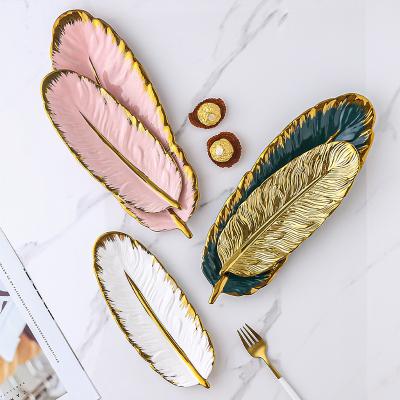 China Home Decor Banana Leaf Feather Ceramic Light Balance Dish Nordic Gold Luxury Dessert Dishes Dish for sale