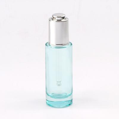 China Low MOQ 30ml Matte Black Clear Glass Personal Care Essential Oil Bottles With Silver Dropper for sale