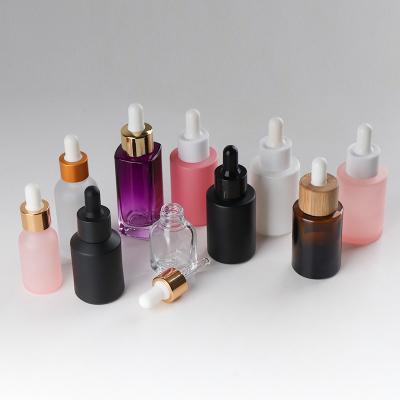 China Personal Care Private Label Red Blue Essential Oil Bottle Pastel Color Amber Glass Bottles With Dropper for sale