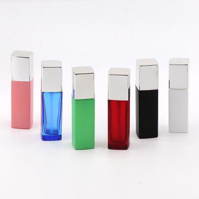 China Personal Care Fancy 40ml Square Shaped Rectangle Serum Lotion Glass Cosmetic Bottles Matte Red Pink Clear Blue With Pump for sale