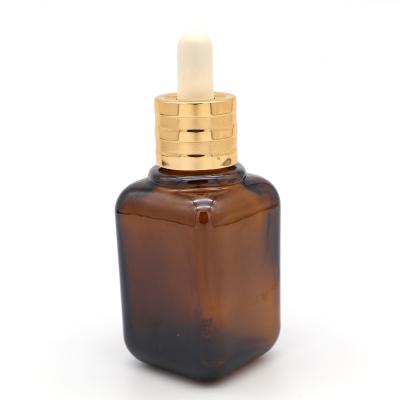 China Personal Care High End Square Dropper Bottle 15ml 1/2oz Amber Glass Rectangle Glass Dropper Bottles With Gold Cap for sale