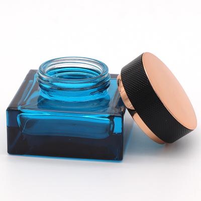 China Personal Care Skin Care Cream Jar 30g 50g Glass Blue Glass Cosmetic Jar With Custom Logo Material Lid for sale