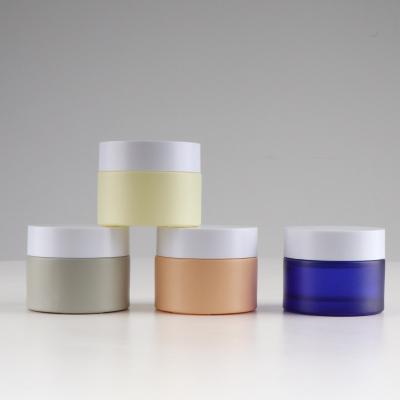 China Hot Sale 30g 50g Personal Care Logo Printing Cosmetic Fancy Glass Jars For Empty Lip Balm for sale