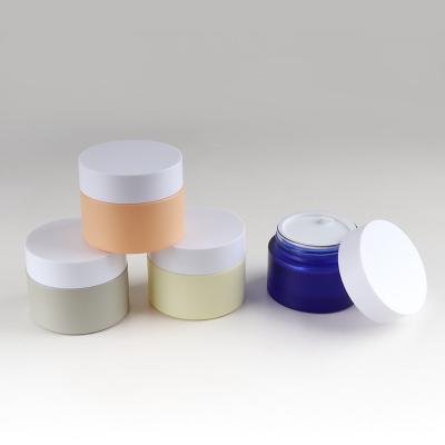 China Personal care in good quality stock cosmetic glass jar 30g 50g for face cream for sale