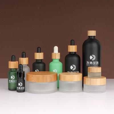 China Personal Care Fast Delivery Frosted Clear Black 5ml Serum Essential Oil Bottles 15 G 30 G 50 G 100g Bamboo Lid Glass Jar for sale