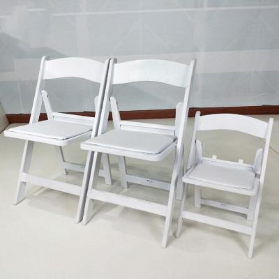 China Factory Price Modern America Resin Padded White Plastic Outdoor Folding Chair For Event Weddings for sale