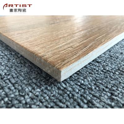 China New Design Rustic Wood Tiles Timber Ceramic Flooring Tiles Glazed Ceramic Tiles For Living Room And Hotel for sale