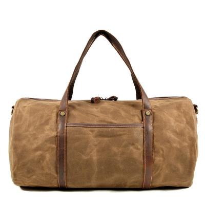 China Solid Color Men's Travel Bag Canvas With Leather Large Capacity Portable Waterproof Duffel Bag Business Red Luggage To Travel for sale