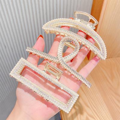 China Gold Hair Clips 0629 Wholesale Metal Diamond Pearl Hair Claw Clips for sale