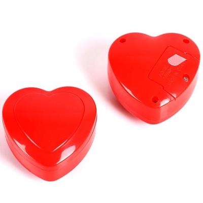 China Promotional Activities Customized Plastic Heart Shape Beaten Package Toy Custom For Kids for sale