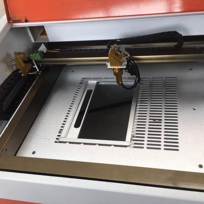 China Laser CUTTING 3020 worktable 40w cheap co2 laser engraving machine for nonmetal for sale