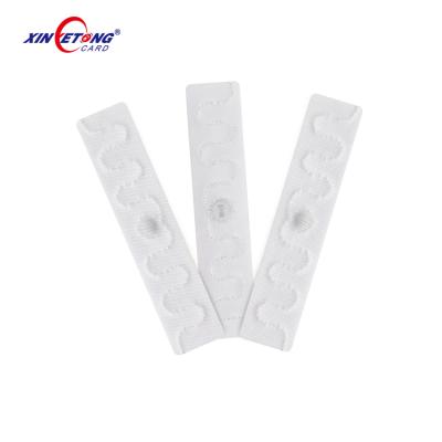 China Waterproof / Waterproof 3 Years Warranty Impinj 96bit Fabric Proximity RFID Laundry Tag for sale