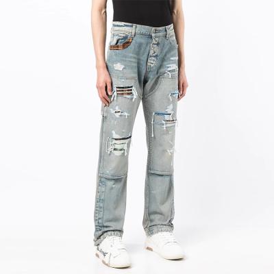 China Viable Custom Straight Jeans Mens Splicing Trouser Leg Opening Button Split Cotton Fringed Washed Jeans for sale