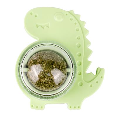 China Viable Hot Selling Interactive Dinosaur Shape Rotating Catnip Ball Cat Cleaning Teeth Molar Toy for sale