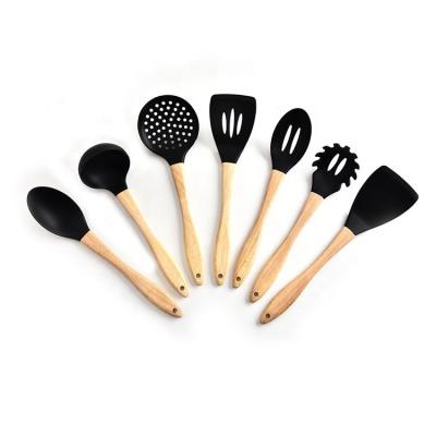 China Sustainable Food Grade 7 Pcs Kitchen Accessories Silicone Nonstick Kitchenware Utensils With Wooden Handle for sale