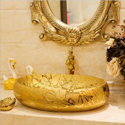 China Easy Clean Gold Oval Art Ceramic Hand Sink for sale