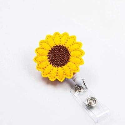 China Retractable Badge Reel Holder Badge Reel Holder Cute Nurse Sunflower Badge Reel Holder With Clip Cxbr03433 for sale