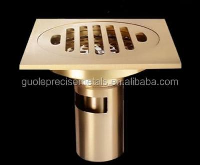 China Brass Strainer Gold Square Bath Floor Drain Shower Sewage Drainer for sale