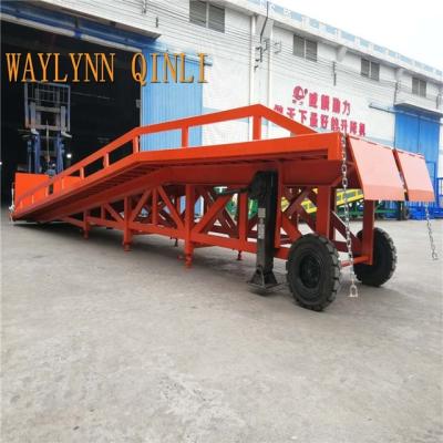 China Easy operation dock leveler hydraulic mobile forklift ramp loading equipment 6t-12t ton with warehouse for sale