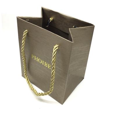 China Recyclable Printed Your Own Logo Gold Texture Gift Craft Shopping Paper Bag With Ribbon Handles for sale