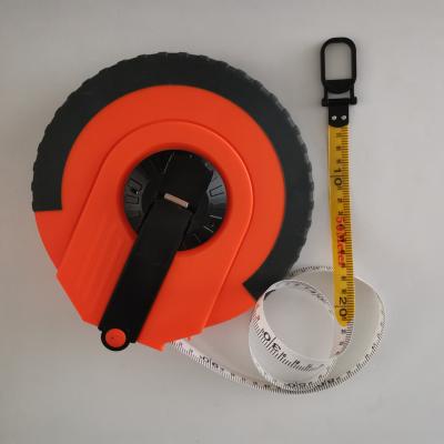 China Survey Fiberglass Elastic Soft Rubber Plastic Retractable Tape 50 Meters for sale