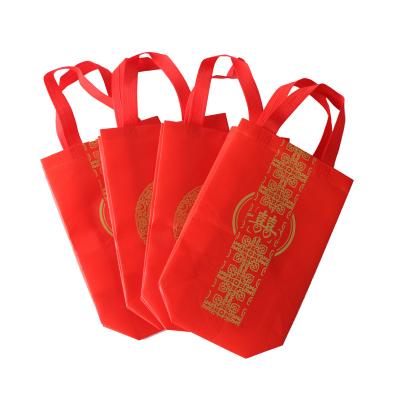 China Xizi Recyclable Red Nonwoven Handbag Wedding Supplies Folding Film Bag for sale