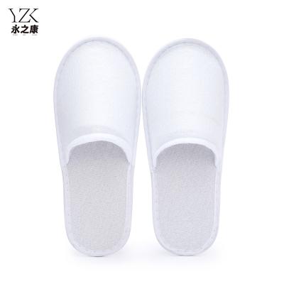 China Exquisite Disposable Hotel Amenities Personalized Closed Toe Spa Washable Napped Fabric White Indoor Quiet Hotel Slippers for sale