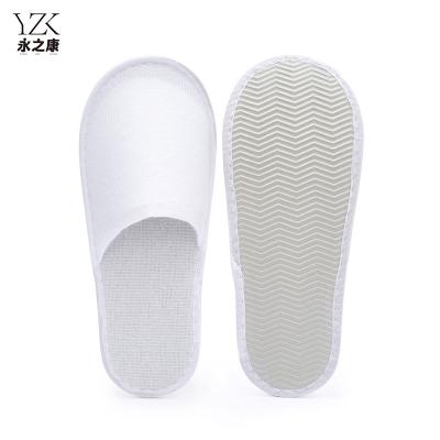 China Exquisite Disposable Hotel Amenities Cheap Eva Sole Nap Fabric Guest Indoor Disposable Slippers Closed Toe Hotel Slippers for sale