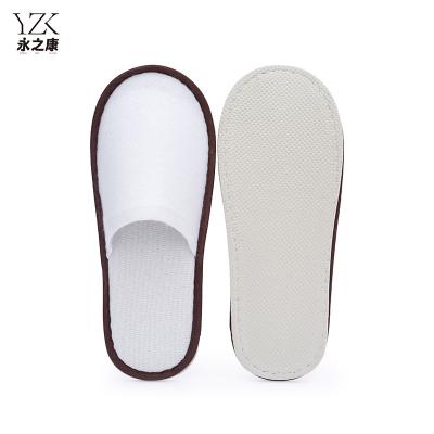 China Exquisite Disposable Hotel Amenities Cheap Eva Sole Nap Fabric Guest Indoor Disposable Slippers Closed Toe Hotel Slippers For Men for sale