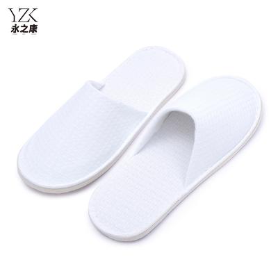 China Exquisite Disposable Hotel Amenities Cheap Wholesale Custom Personalized eco-friendly Luxury EVA Sole Waffle Weave White Hotel Disposable Slippers for sale