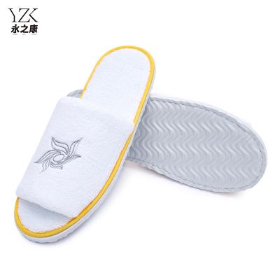 China Exquisite Disposable Hotel Amenities Recycle Using Coral Fleece Disposable EVA Sole Hotel Slippers With Custom Logo for sale