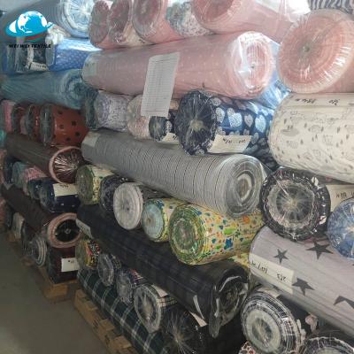 China Soft a grade stocklot 100% cotton printed flannel fabric for bed sheet for sale