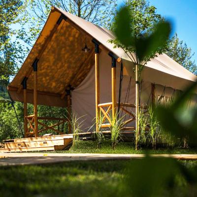 China Luxury Wooden Safari Glamping Tent Outdoor With Frame(80x60x3mm) Plywood Poles Plywood Pole Prefab Lodge Canvas Waterproof Bathroom Prefab Resort Room For Sale for sale