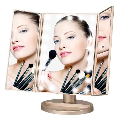 China Magnification 3X/2X/1X Touch Screen Makeup Trifold Led Vanity Mirror With Lights for sale