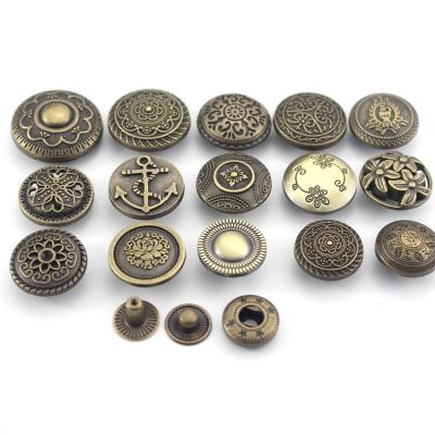 China Custom Embossed Metal Snap Buttons With Logo For Coats Clothes for sale