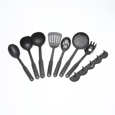 China Durable Color 7Pcs Black Handle Nylon Kitchen Cooking Portable Utensil Set With Hanger for sale