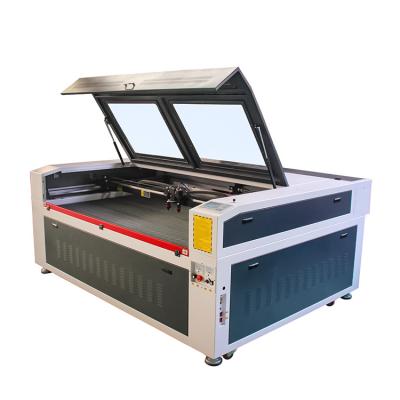 China Engraving and Cutting 100w/120w/150w Garment/Cloth/Textile/Leather 1612/Home Cloth CO2 Laser Cutting Machine with Auto Feeding for sale