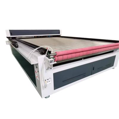 China 100w/120w/150w garment/cloth/textile/leather/home fabric laser engraving and cutting machine with auto feeding for sale