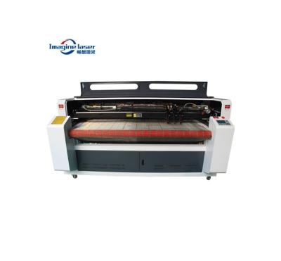 China Engraving and reducing top quality 100w 130w 150w large format fashion clothes/garment/clothing fabric letter cutting machine price for sale