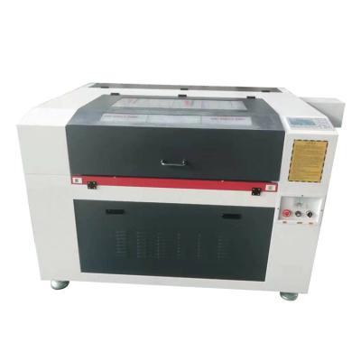 China Engraving and Cutting 100w/120w/150w Garment/Cloth/Textile/Leather/Home Cloth CNC 6090 1390 1610 Laser Cutting Machine Price for sale