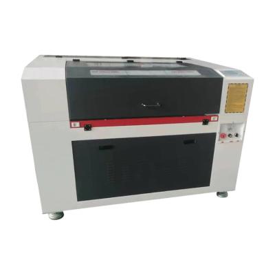 China Engraving and Cutting CNC 600*900mm Work Area Laser Engraving Machine for Paper, Leather, Plywood for sale