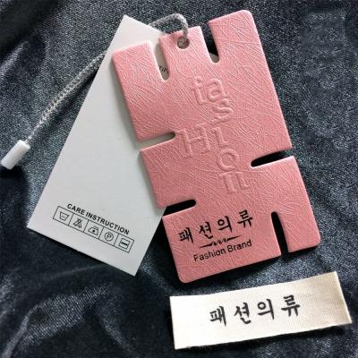 China Sustainable Apparel Brand Accessories Custom Logo Tag Label Embossed Hang Tag Apparel Folded Hangtag for sale