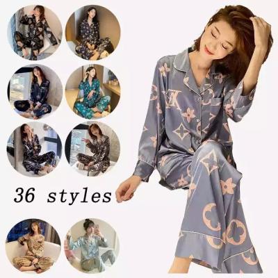 China RTS New Ice Silk Women's QUICK DRY Pajamas Long Sleeves Plus Size Satin Home Designer Silk Pajamas Loose Pajamas for sale